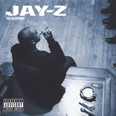 jay - z the blueprint album cover with a man sitting at a table in front of him