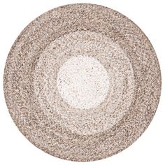 a round rug with white and brown colors on the bottom, in an oval shape