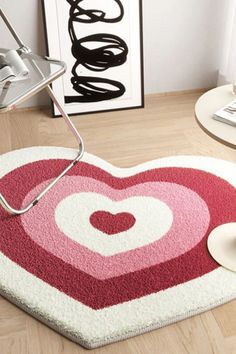 a heart shaped rug on the floor in a living room