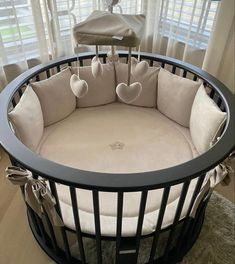 a baby crib with hearts on it