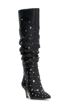 Glossy studs and a slouchy shaft create an edgy aesthetic on a leather knee-high boot balanced by a pointy toe and tapered heel. 2 1/4" heel 16 3/4" shaft; 16 1/2" calf circumference. Wide calf Pull-on style Leather upper/synthetic lining/rubber sole Imported Studded Knee-high Party Boots, Knee-high Studded Boots For Party, Studded Fitted Heeled Boots For Night Out, Fitted Studded Heeled Boots For Night Out, Fitted Leather Boots With Rhinestone Rivets, Fall Night Out Boots With Rivets, Edgy Aesthetic, Knee High Leather Boots, Wide Calf