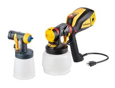 two yellow and black sprayers sitting next to each other on top of a white surface