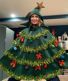 a woman in a green christmas tree costume