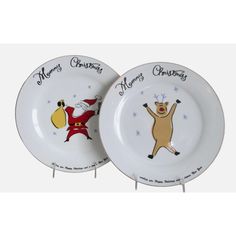 two christmas plates with santa claus and reindeer on them