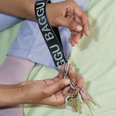 The Baggu logo key chain is back again at last! It's easy to find and hard to forget. Nylon webbing with stainless steel hardware. 7" x 1" Machine washable.