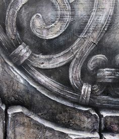 an artistic painting on the side of a building in black and grey tones with swirls