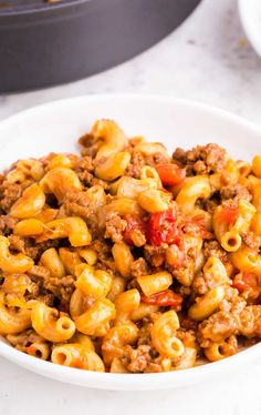 a white bowl filled with macaroni and cheese