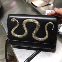 Embossed Cutie Decorative Snake Crossbody Bag Black Crossbody Box Bag With Shoulder Strap, Black Crossbody Flap Bag With Single Shoulder Strap, Black Clutch Bag For Errands, Black Clutch For Errands, Black Evening Flap Bag With Single Shoulder Strap, Black Clutch Shoulder Bag For Errands, Snake Purse, Snake Bag, Aldo Bags