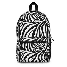 Its time to get ready for heading back to school your child will want to stand out with this Zebra Print Backpack! This backpack is perfect for anyone who loves animals. This backpack is sure to be a one of a kind. Our backpacks are roomy and durable backpack, made from 100% spun polyester and weighs just 1.3 lbs. Backpack dimensions are approximately 18.11in tall, 11.81in wide and 5.12in deep. The backpack is light, strong and long-lasting, water resistant with adjustable shoulder straps.  A total of 4 compartments - 1 main zip pocket, 1 front pocket, bottle pocket on the side and inside compartment for a laptop or tablet. Whether you're shopping for a special gift or just want to provide a comfortable and stylish backpack, this backpack is the perfect choice. Order yours today! **Also lo Casual Backpack With Animal Design For Back To School, School Backpack With Animal Design, Back To School Backpack With Animal Design, Back To School Animal Design Standard Backpack, Student Backpack With Animal Design For Back To School, Back To School Backpack With Animal Design For Students, Back To School Student Backpack With Animal Design, Casual Standard Backpack With Animal Design, Lunch Kit