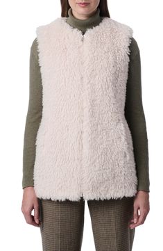 Keep it cozy for the between season in a zipped-up vest crafted from fuzzy faux shearling. Front zip closure Collarless Side-seam pockets 100% polyester faux shearling Dry clean Imported Sleeveless Outerwear With Faux Fur Lining For Fall, Sleeveless Fall Outerwear With Faux Fur Lining, Sleeveless Outerwear With Faux Fur Trim For Fall, Fall Sleeveless Outerwear With Faux Fur Trim, Sleeveless Faux Fur Outerwear, Faux Shearling Vest, Heavy Winter Coat, Faux Fur Vest Black, Shearling Vest