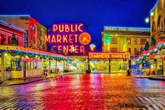 an image of a public market center in the evening time with christmas lights on it