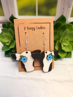 Adorable Cow Wood Dangle Earrings How CUTE is this Hand Painted Cow earring Set?!? These wood dangle earrings hang 2.5 inches and are made from lightweight wood. The cow design is laser engraved into the wood. They are the perfect unique handmade gift. Have Questions?? Just send us a Conversation! These will ship via USPS Cow Head Earrings, Cow Earrings, Wood Dangle Earrings, Cow Design, Cow Gifts, Cow Head, Cute Cow, The Cow, Animal Earrings