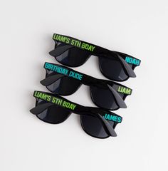 five sunglasses with the name james's 5th day printed on them, all in green and black