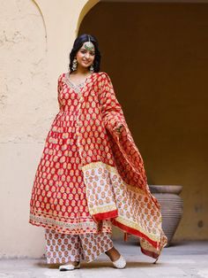 Red Angrakha Anarkali Kurti with palazzo and chanderi dupatta, has a v-neck and full-length sleeves, embellished with hand block printing work all over. Neck: Angarakha Neck Sleeve Length: 3/4th Sleeve Kurta Length: Ankle Length Fabric: Kurta & Bottom - Cotton Dupatta - Chanderi Note: Wash Care Instructions - Dry Clean Only. The product will be shipped within 15-20 days of the order placed Measurements: Size Bust Waist Hip XS 34 28 36 Size 36 30 38 M 38 32 40 L 40 34 42 XL 42 36 44 2XL 44 38 46 Traditional V-neck Semi-stitched Salwar Kameez, Cotton Palazzo Set With Gota Work And Long Sleeves, Cotton Long Sleeve Palazzo Set With Gota Work, Long Sleeve Cotton Palazzo Set With Gota Work, Traditional V-neck Sets For Festivals, Traditional Unstitched V-neck Kurta, Anarkali Sets With V-neck For Festivals, Festive V-neck Palazzo Set With Printed Motifs, Festive Block Print V-neck Set