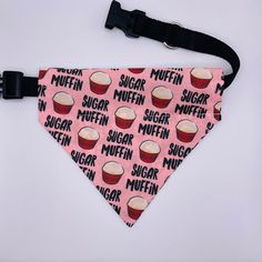 a pink dog bandana with cupcakes and the words sugar muffin on it