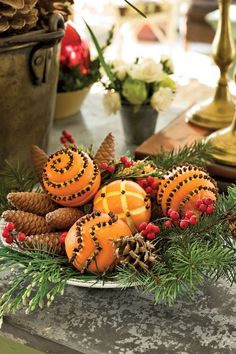 an instagram with oranges, pine cones and berries on it is displayed for the camera