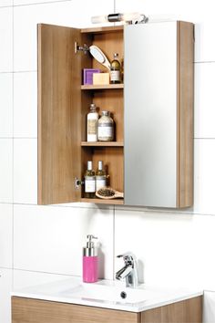 a bathroom sink with a medicine cabinet above it