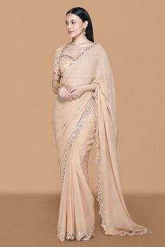 Fawn georgette pre-draped saree with embroidered scalloped cut work border, pleated draped details and attached pallu. Paired with sweetheart neck blouse with all over mirror, stone, bead and zari embroidery. - Aza Fashions Elegant Chiffon Pre-draped Saree With Dupatta, Elegant Chiffon Saree For Wedding, Elegant Chiffon Pre-draped Saree, Elegant Fitted Chiffon Blouse Piece, Elegant Chiffon Blouse Piece For Reception, Elegant Chiffon Blouse For Reception, Elegant Chiffon Pre-draped Saree For Reception, Fitted Chiffon Pre-draped Saree For Wedding, Elegant Chiffon Draped Saree