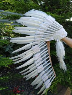 Medium Indian Headdress Replica made with white swan feathers and black cross thread sewn in the front. This great adult headdress is entirely handmade and truly adorable. Perfect photography prop for your special ocasion. Ties in the back for a perfect fit. This will be precious for your costume, or even room decor. Head circumference: 59 centimeters / 23 inches ✈️ Worldwide shipping 🐤 I only use authentic feathers ⛺️ I guarantee highest quality, 100% hand-crafted White Bohemian Costume Hats And Headpieces For Festivals, White Ostrich Feather Headpiece With Feather Trim, White Bohemian Costume Hat For Festivals, Swan Feathers, Feather Drawing, Black Rooster, Indian Headdress, Winter Wonderland Party, Real Turquoise