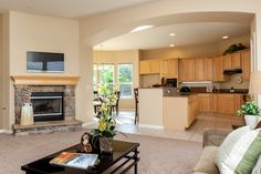 a living room filled with furniture and a fire place