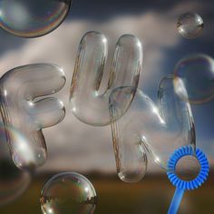 soap bubbles floating in the air with a blue ribbon