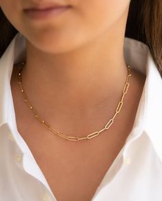 Introducing our version of the iconic paperclip gold chain that is currently a must have for any gold jewelry fan! It's modern, yet classic and pairs with many things from t-shirts to office wear! Layer this with multiple chains for that haute look. 14K yellow gold solid links 16" length High polished Paperclip Necklace Layering, Minimalist Chic Outfit, Paperclip Chain Necklace, Paperclip Necklace, Necklace Ideas, Minimalist Chic, Yellow Gold Jewelry, Ring Fit, Office Wear