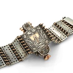 The Ceremonial Horse Bracelet showcases a beautifully handcrafted horse made of sterling silver with an 18K rose gold medieval chamfron, an armor worn by horses in medieval times. The chamfron is adorned with sparkling white diamonds and a central ruby gem. The horse's eyes are crafted from shimmering cabochon sapphires, and its hair is set with champagne colored diamonds. The bracelet is made with sterling silver, champagne diamonds, and 18K rose gold horseshoes, completing the luxurious look o Luxury Ceremonial Bracelets, Luxury Engraved Bracelets For Ceremonial Occasions, Luxury Silver Bracelets With Box Clasp, Luxury Ceremonial Jewelry With Historical Design, Medieval Jewelry With Historical Design For Gift, Formal Byzantine Bracelets With Engraving, Medieval Jewelry With Historical Design As Gift, Formal Byzantine Bracelets With Engraved Details, Medieval Style Jewelry With Historical Design