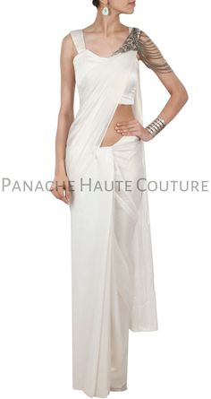 This designer saree gown feature in the white crepe fabric is on a discounted price for a limited period. Can be customised in any color of your choice. White Draped Pre-draped Saree For Wedding, Elegant Draped Designer Gown, Elegant White Draped Saree, Elegant Draped Gown For Designer Wear, Elegant White Georgette Pre-draped Saree, Traditional White Pre-draped Saree For Formal Occasions, White Saree For Evening With Traditional Drape, Elegant White Pre-draped Saree With Traditional Drape, Elegant White Pre-draped Saree In Traditional Style