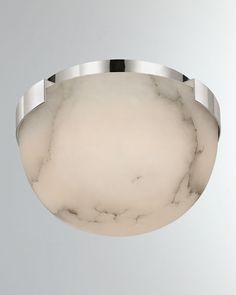 a ceiling light with a white marble finish