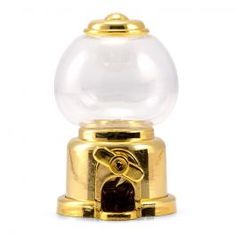 a gold plated gumper machine with a glass ball on it's top