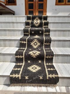 an area rug is on the stairs in front of a door and steps leading up to it