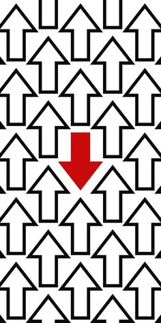 an image of a red arrow in the middle of black and white geometric pattern with houses