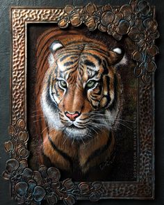 a painting of a tiger in a frame on a black wall with flowers around it