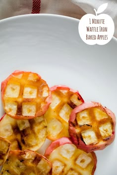 four pieces of apple pie on a white plate with text overlay that reads 1 minute waffle iron baked apples