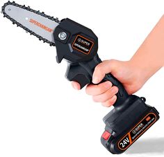 a person holding a chainsaw in their hand with the cordless tool attached to it