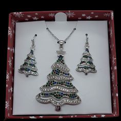 Unbranded Christmas Tree Necklace & Earrings Box Set Nwt. This Set Really Sparkles! Silver Trees With Various Color Gems. Lobster Claw Clasp With Extension. (Chain Is Still Sealed In Back Of Box) See Pictures For Any Additional Information And For Any Approximate Measurements Blue Sapphire Halo Ring, Christmas Tree Necklace, Sapphire Halo Ring, Rose Gold Ring Set, Big Stone Ring, Hamsa Bracelet, Rhinestone Statement Necklace, Dichroic Glass Pendant, Earring Box