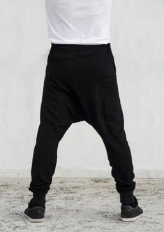 "Panelled drop crotch joggers with 5 buttons offset closure & elastic waistband [] ENJOY FREE SHIPPING [] > Place an order of 150€ minimum items' value > Add coupon code VMFREESHIP at checkout > Benefit from free shipping [] EXTRA BENEFITS [] > All orders above 25€ win a \"Thank you\" 10% discount coupon available for the next order > All orders receive special surprise gifts. [] GREEK CUSTOMERS [] Buyers from Greece are advised to visit the official VOIDmode shop > (http:/ Bespoke Clothing, Mens Leggings, Surprise Gifts, Discount Coupon, Mens Trousers, Coupon Code, Parachute Pants, Mens Pants, Greece