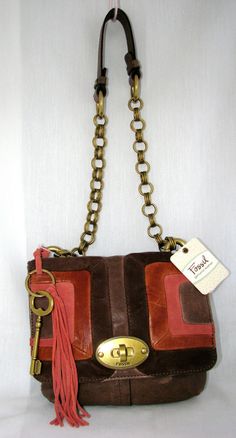 100% AUTHENTIC FOSSIL QUINN MULTI-BROWN SUEDE/LEATHER PATCHWORK,BRASS HARDWARE SHOULDER, HAND BAG+FLAP  BRAND NEW with TAGS! 100% GENUINE LEATHER Very Stylish! Approximate measurements: 9" L x 8.5" H x 2.0" W CROSSBODY STRAP DROP 14.0"   EXTERIOR: BEAUTIFUL MULTI-TONE BROWN PATCHWORK GENUINE SUEDE/LEATHER FLAP DESIGN WITH BRASS TURN-LOCKS SINGLE LEATHER CROSSBODY STRAP, ATTACHED WITH MULTI-RING BRASS TONE CHAIN HARDWARE    BRASS TONE HARDWARE FOSSIL KEY LOGO ON THE BACK MAUVE LEATHER TASSEL+ FOS Key Logo, Multi Ring, Leather Patchwork, Leather Tassel, Leather Purse, Brass Hardware, Brown Suede, Crossbody Strap, Hand Bag