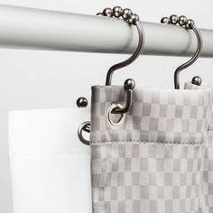 a close up of a purse hanging on a rail