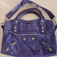 Gorgeous Soft Leather Balenciaga City Bag With Giant Silver Hardware. Preowned Condition. Beautiful Bag. No Mirror Or Dust Bag. I Can Give You A Fashionphile Dust Bag. Length: 14.75 In Width: 5 In Height: 9.5 In Drop: 5 In Sorry No Trades. Also This Is An Authentic Luxury Purse Priced Very Reasonably - Do Not Insult Me With Lowball Offers! They Will Be Not Be Accepted And You Are Wasting Everyone’s Time. Thanks. Designer Satchel With Branded Hardware For Everyday Use, Designer Travel Shoulder Bag With Silver-tone Hardware, Luxury Purple Bags For Everyday Use, Luxury Everyday Purple Bags, Luxury Purple Shoulder Bag With Double Handle, Designer Shoulder Bag With Branded Hardware For Errands, Designer Crossbody Satchel With Silver-tone Hardware, Designer Purple Double Handle Shoulder Bag, Designer Purple Crossbody Shoulder Bag