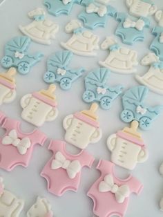 baby shower cookies are arranged on a table for display and to be used as decorations