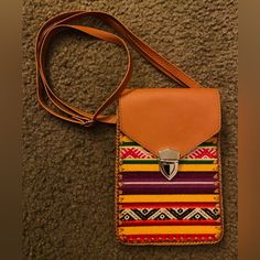 ~ Handmade Mexican Crossbody Bag ~ - Very Colorful Patterned Purse That Was Handmade In Mexico. There’s A Buckle Closure On The Front With 2 Inner Pockets. Adjustable Strap With Lots Of Length So You Are Free To Make It Short Or Long. The Purse Itself Is A Small Size, More Like A Clutch. Please Refer To Measurements. ~ Item Details ~ - Condition: Brand New - Never Used - No Flaws Color: Tan - Red - Orange - Yellow - Purple - Green - Black - White Material: Faux Leather & Fabric Measurements: Hei Multicolor Phone Bag With Adjustable Strap For Daily Use, Casual Multicolor Shoulder Phone Bag, Multicolor Pouch Phone Bag For Daily Use, Rectangular Purple Phone Bag For Daily Use, Casual Multicolor Rectangular Phone Bag, Purple Rectangular Phone Bag For Daily Use, Purple Rectangular Phone Bag, Daily Use Purple Rectangular Phone Bag, Multicolor Casual Phone Bag With Adjustable Strap