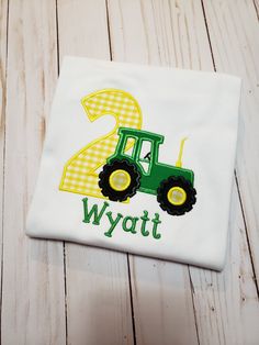 a birthday shirt with a tractor and the number two on it