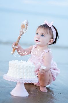 toddler girl in pink and white outfit plays with cake and wooden spoon during cake smash on Cape Cod beach by the surf with Cape Cod MA cake smash photographer Nicole Starr Photography Pastel Cake Smash, Bali Nails, Boston Cake, Dreamy Cake, Pink And White Outfit, Milestone Cake, Cake Smash First Birthday, Pastel Cake