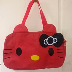 Nwt Sanrio Duffle Bag/ Weekender Bag Red & Pink Colors Available Pink Duffle Was Bought With A Minor Defect But It's Still Usable-See Pic 19" W X 12" H Lightweight Adjustable Strap Cute Red Bag With Cat Design, Red Hello Kitty School Bag, Red Hello Kitty Bag For Everyday Use, Red Hello Kitty Print Bag For Everyday Use, Red Hello Kitty Travel Bag, Red Kawaii Bag For Daily Use, Playful Red Shoulder Bag For Daily Use, Casual Red Hello Kitty Print Bag, Hello Kitty Suitcase