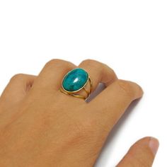 A gold Turquoise ring is just the thing to show her just how unique she is. Is there a special meaning for you in the month of December? Choosing this Turquoise statement ring is an additional way to commemorate December as it is the birthstone for this particular month. All eyes will be on your beloved one with this elegant December birthstone ring made from 14k solid yellow gold designed shank and a massive dreamy green - blue turquoise gemstone. This natural Turquoise Ring is a remarkable and Blue Gem Ring, Turquoise Ring Gold, Boho Turquoise Ring, Gold Turquoise Ring, Boho Rings Gold, Blue Gemstone Ring, Turquoise Statement Ring, December Birthstone Ring, Boho Turquoise