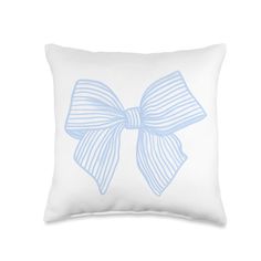 a white pillow with a light blue bow on the front and back of it,