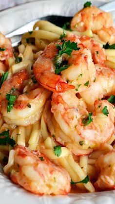 pasta with shrimp and parsley on top