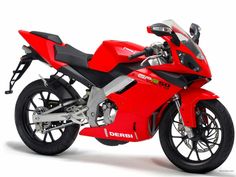 a red motorcycle is shown on a white background