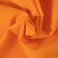 an orange fabric with very thin folds